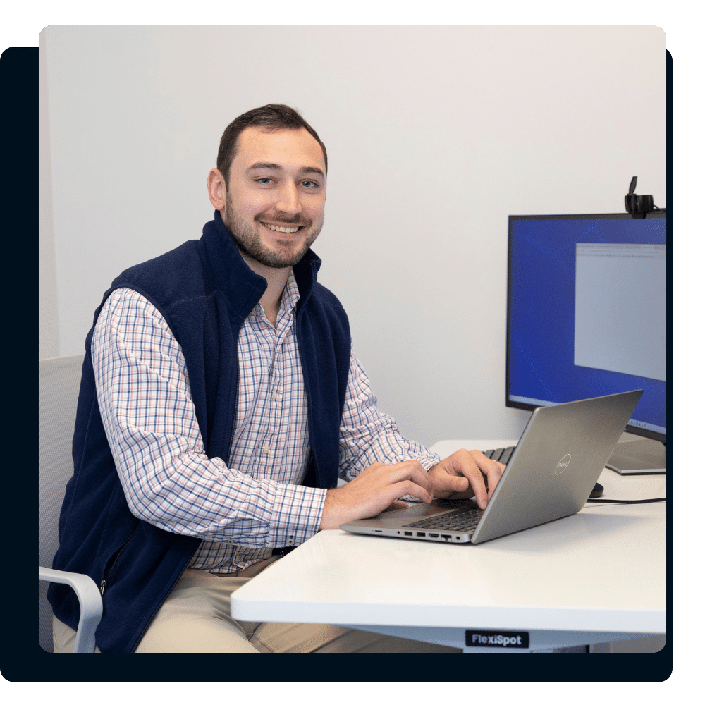 Charles IT team member providing IT support in a financial services office setting