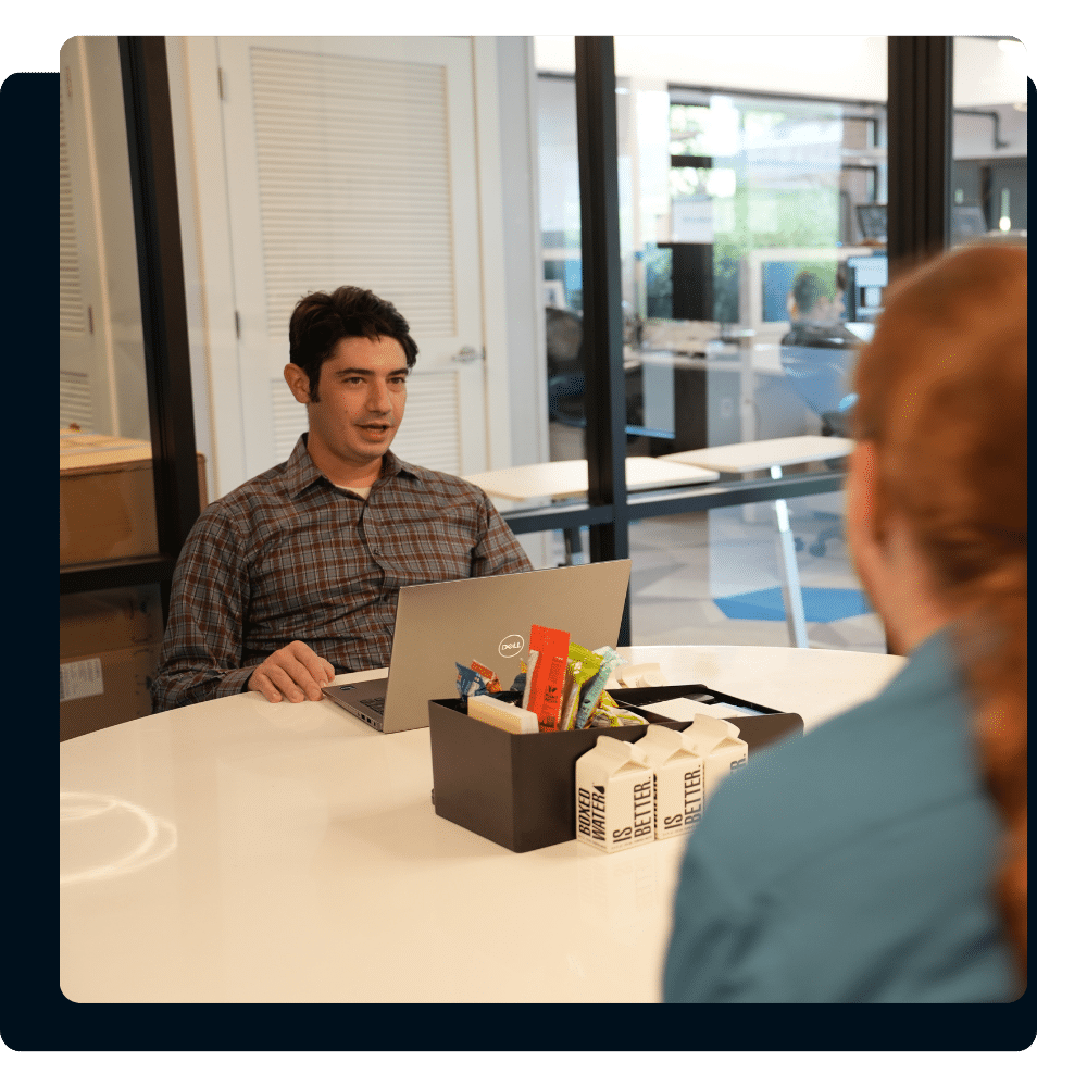 Charles IT team member meeting with a client during an ongoing IT partnership