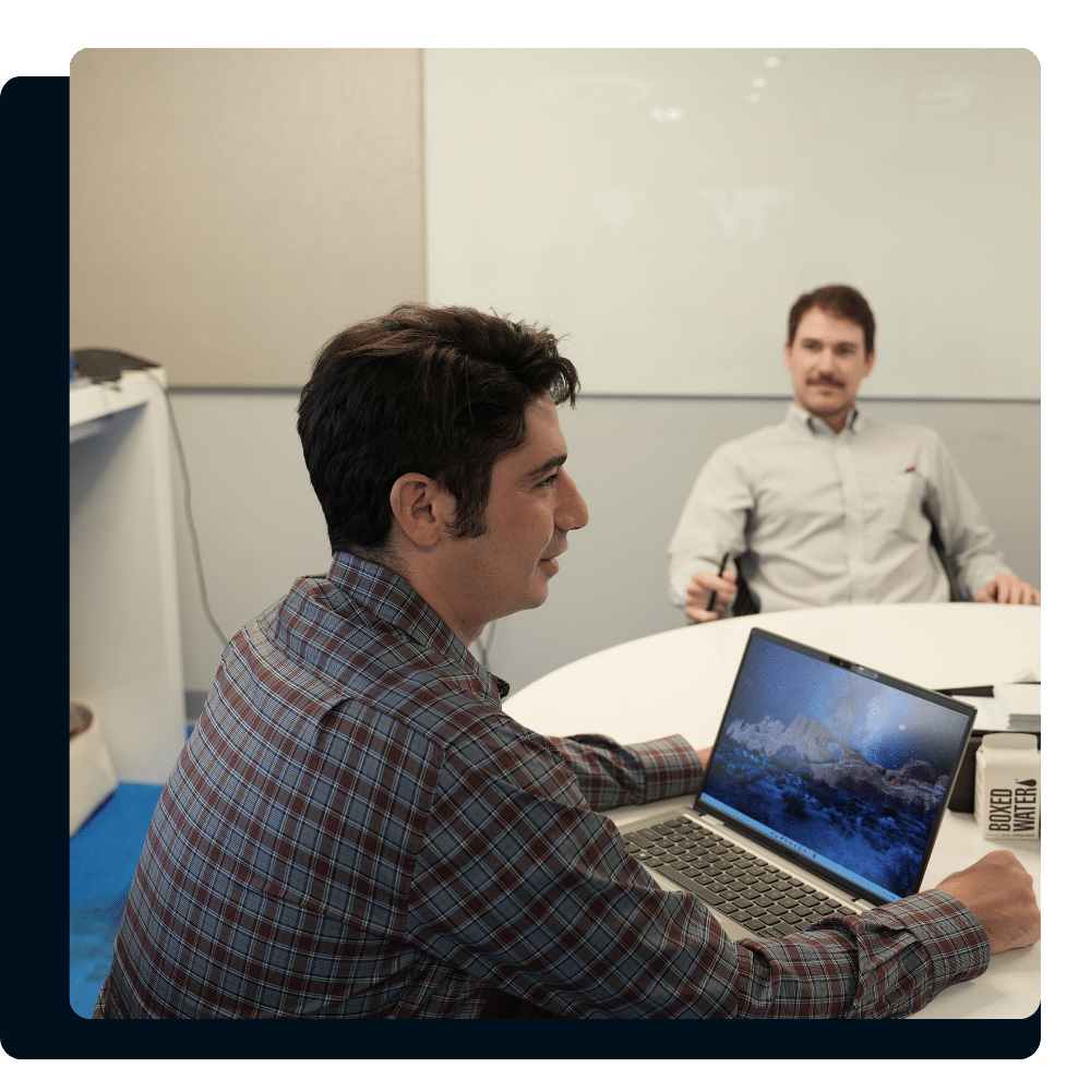 Charles IT team members collaborating with a professional services client in a meeting